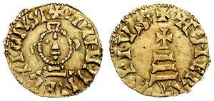 Ok. 680 r. złoty tremissis Wizygocki, 15 mm. średnicy, 1.42 g. Awers - głowa Chrystuas, zza niej widać ramiona krzyża. Rewers - krzyż na trzech stopniach (wzgórze? 3 stopnie jako trójca święta?).